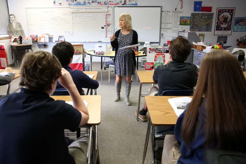 LuAnn Dolly, American history teacher, gives a lesson to eighth grade students at The June...