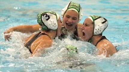 Southlake Carroll’s Kamdyn Geisel (3), Maile Farden (4), and Sydney Rubin (7) celebrate...