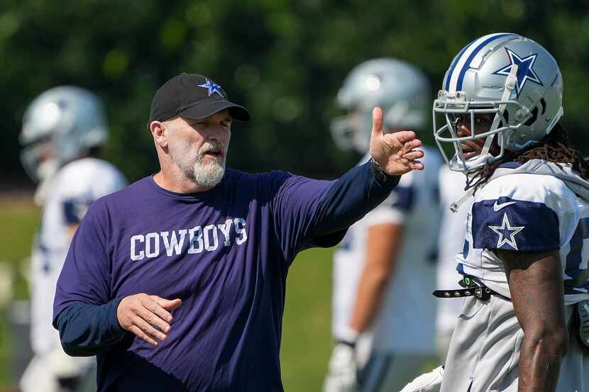 Dallas Cowboys defensive coordinator Dan Quinn directs players as wide receiver CeeDee Lamb...