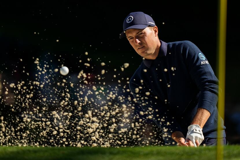Jordan Spieth hits from the bunker on the 16th hole during the final round of the Masters...