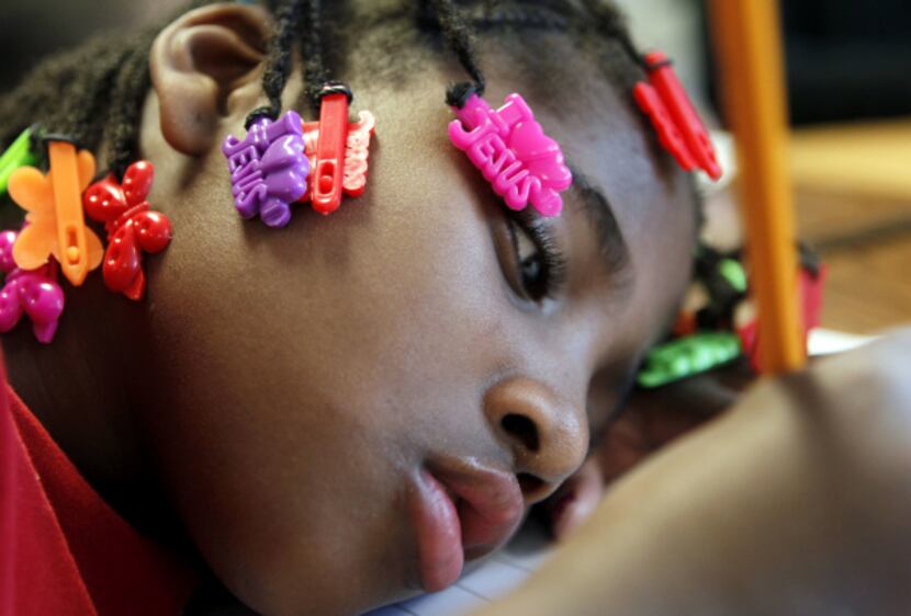 Myvonjayla Davis writes a letter to her father, part of an assignment in her first-grade...