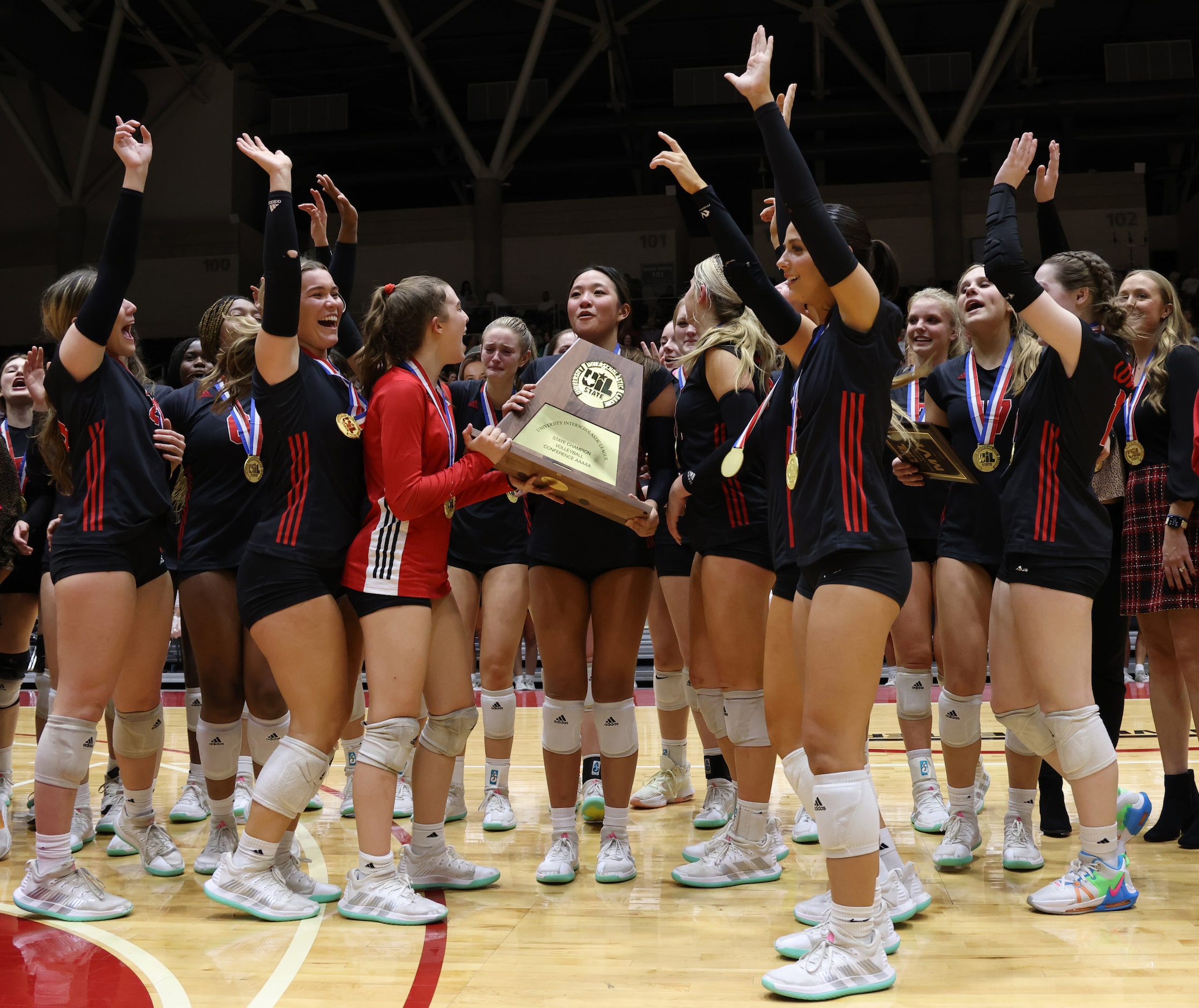 Lovejoy players celebrate with the Class 5A state championship trophy following their...