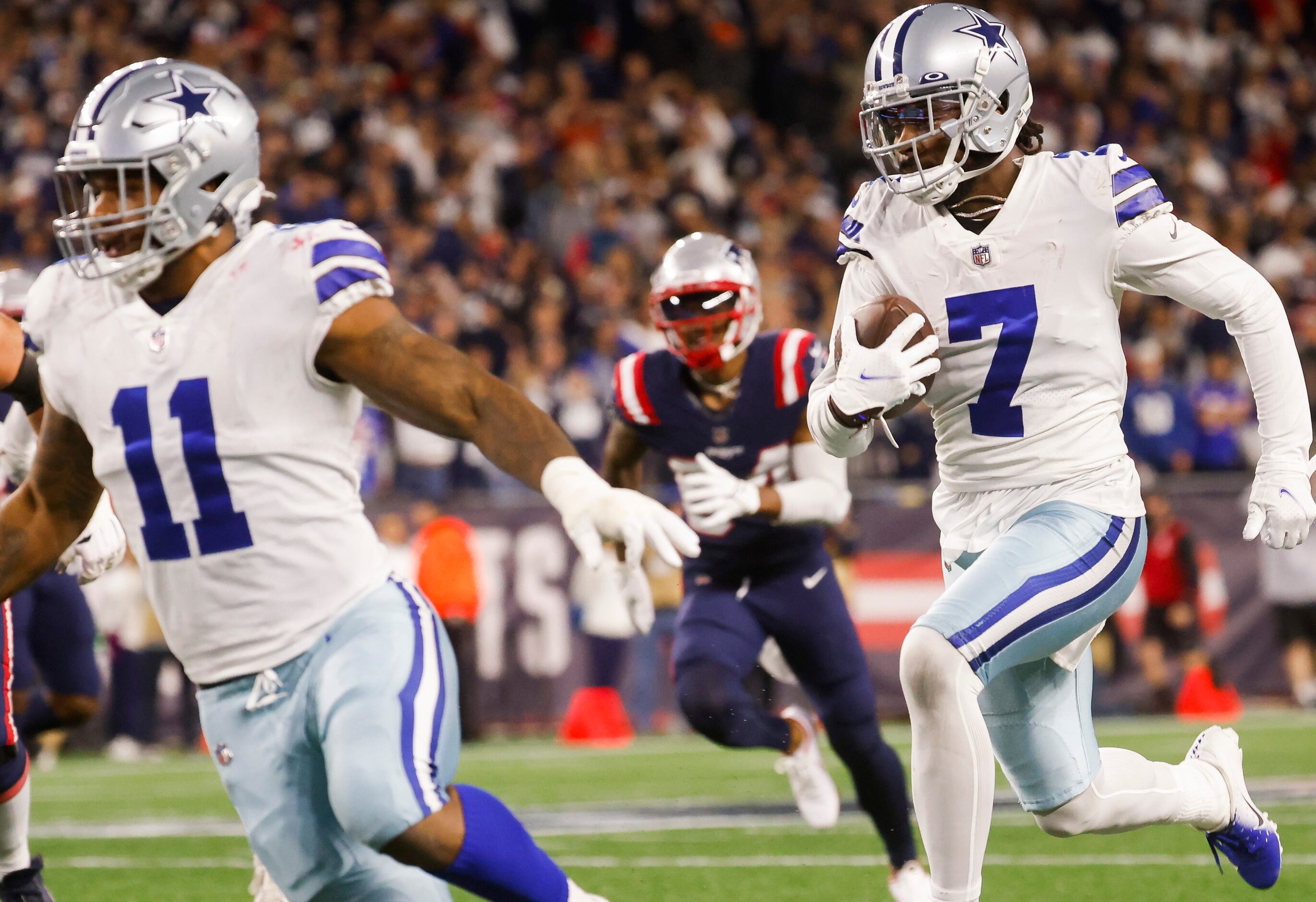 Dallas Cowboys cornerback Trevon Diggs (7) runs in for a touchdown after intercepting a pass...