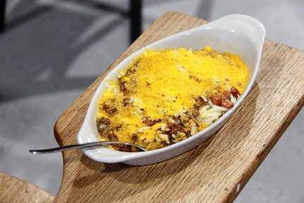 What's "three-way" chili at Coney Island Hot Weiner Shop? It's chili with cheese on top of...