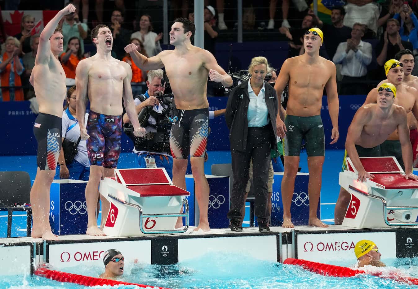 Members of the United States men's 4x100-meter freestyle relay team (from left) Chris...