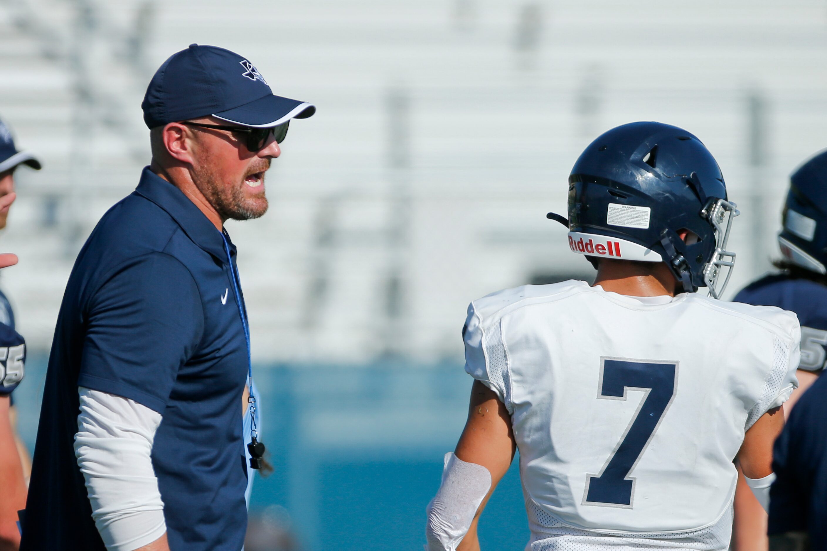 Argyle Liberty Christian head coach Jason Witten speaks with a player during a football...