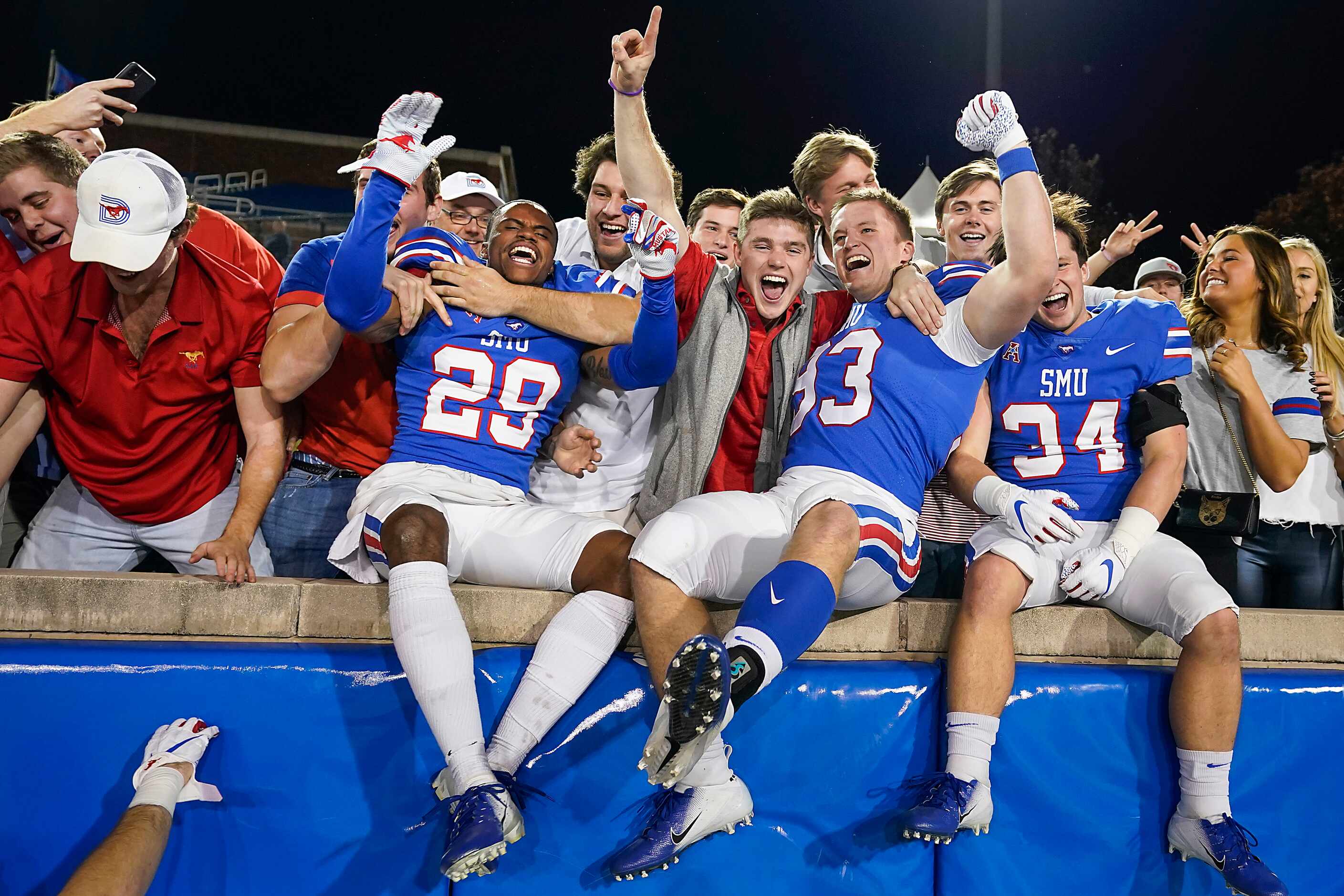 SMU cornerback Justin Guy-Robinson (29), place kicker Kevin Miles (93) and safety Brice...