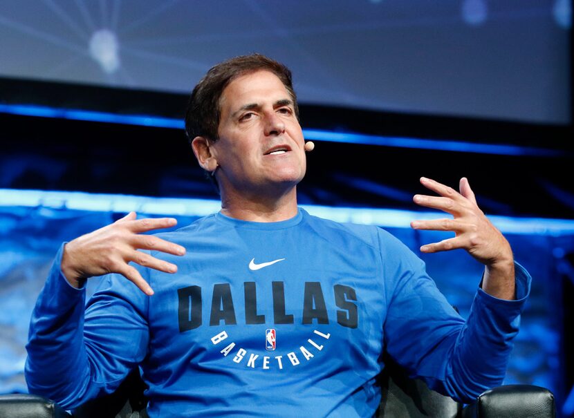 
Dallas Mavericks owner Mark Cuban, right, answers question from Scott Murray during the...