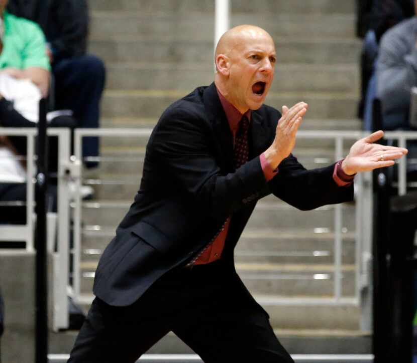 Mansfield Timberwolves head coach Duane Gregory encourages the team during the second half...