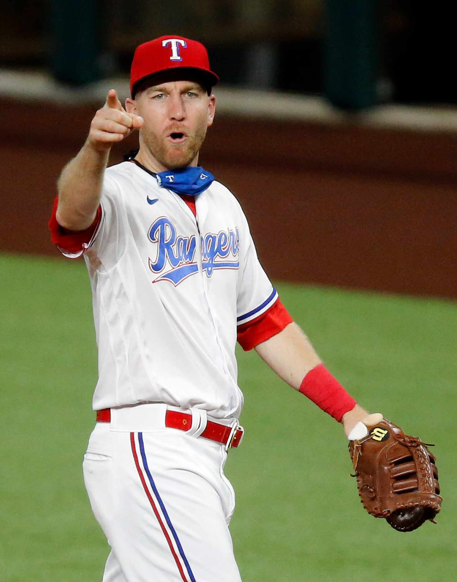 Texas Rangers third baseman Todd Frazier (21) points to relief pitcher Joely Rodriguez (57)...