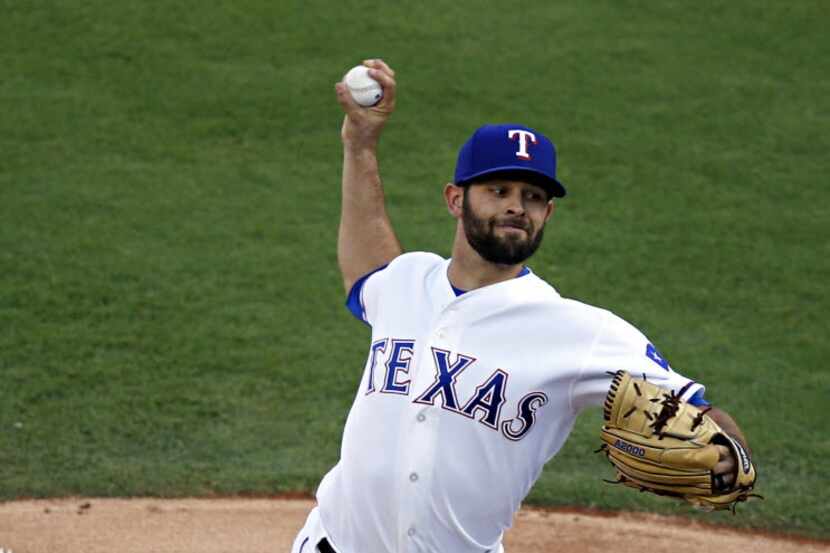 Texas Rangers starting pitcher Nick Martinez deliver during the first inning against the...
