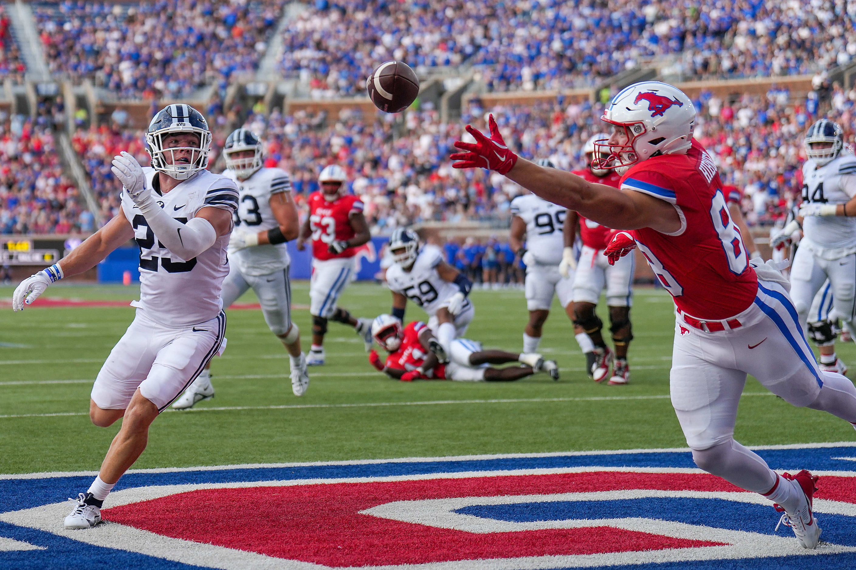 A pass from SMU quarterback Kevin Jennings goes off the hands of tight end Matthew Hibner...