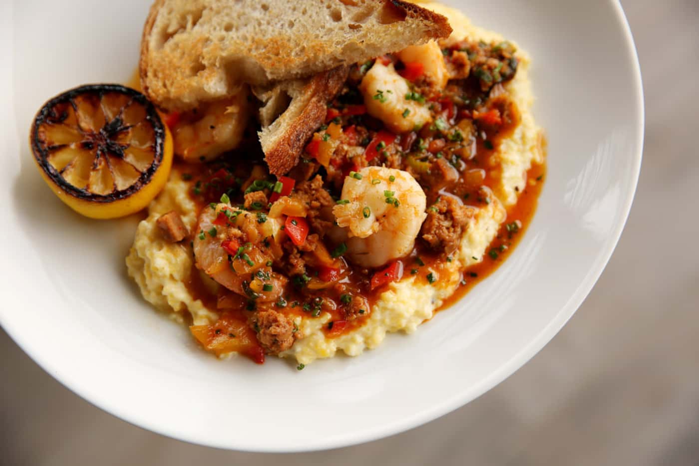 Low Country shrimp and grits served inside Tupelo Honey restaurant in Frisco, Texas Tuesday...