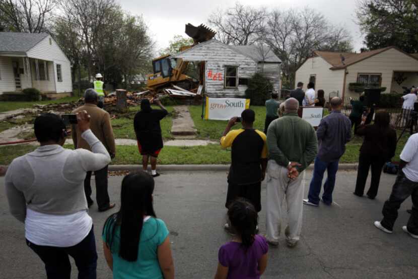 Neighborhood residents looked on back in March 2012 as Dallas Mayor Mike Rawlings kicked off...