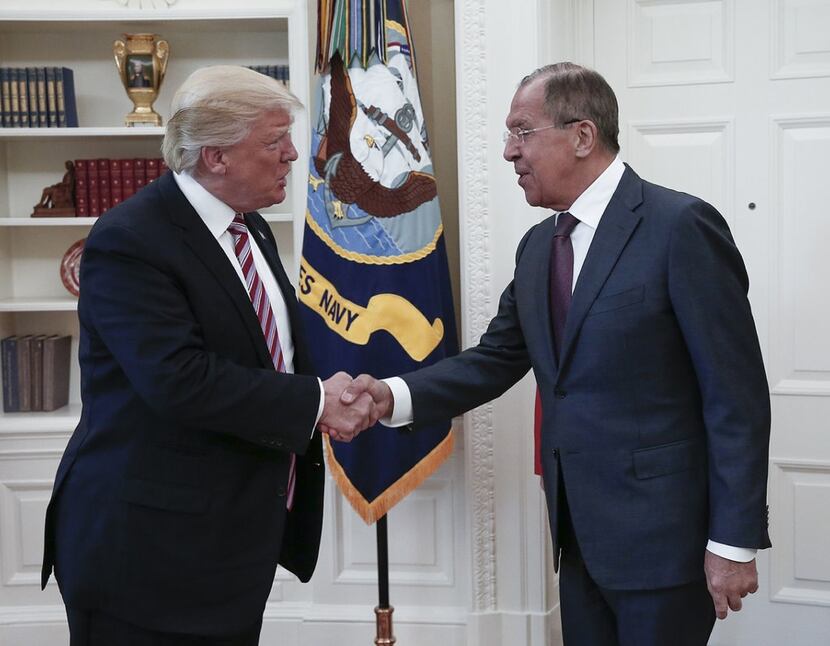  President Donald J. Trump shaking hands with Russian Foreign Minister Sergei Lavrov  during...
