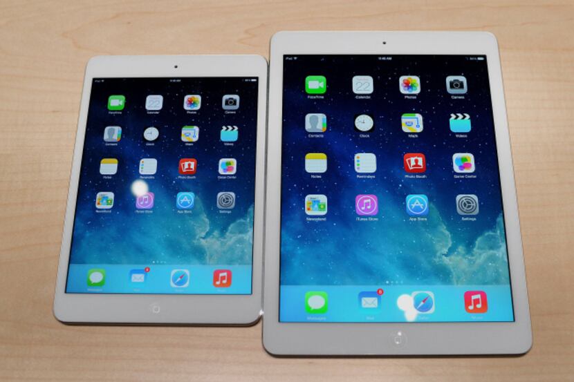 The Apple Inc. iPad Mini, left, and iPad Air were introduced  in time for holiday shoppers.
