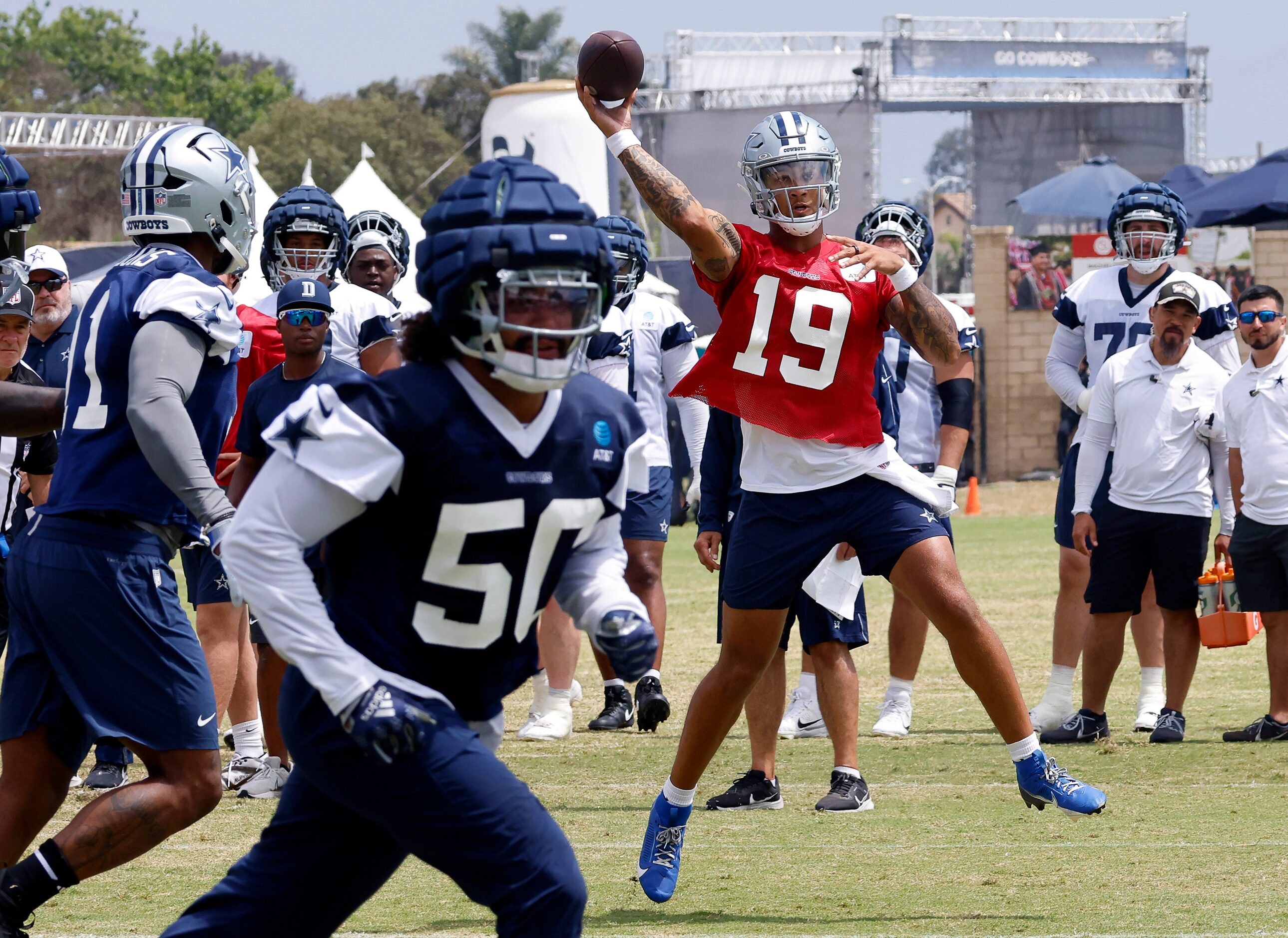 Dallas Cowboys quarterback Trey Lance (19) tosses a pass during 7-on-7 plays at training...