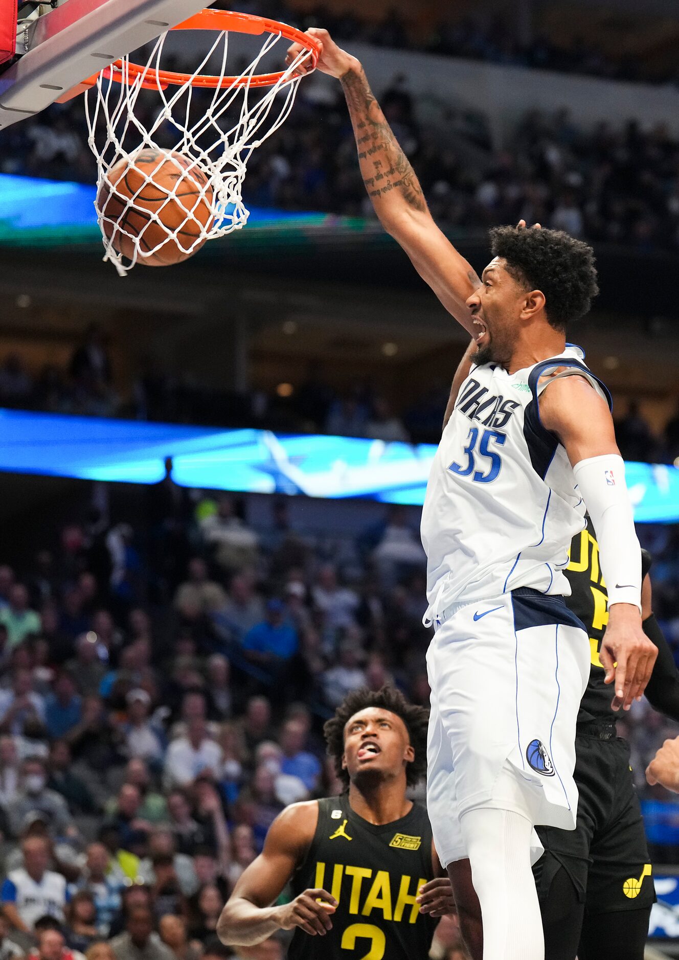 Dallas Mavericks center Christian Wood (35) dunks the ball past Utah Jazz guard Collin...