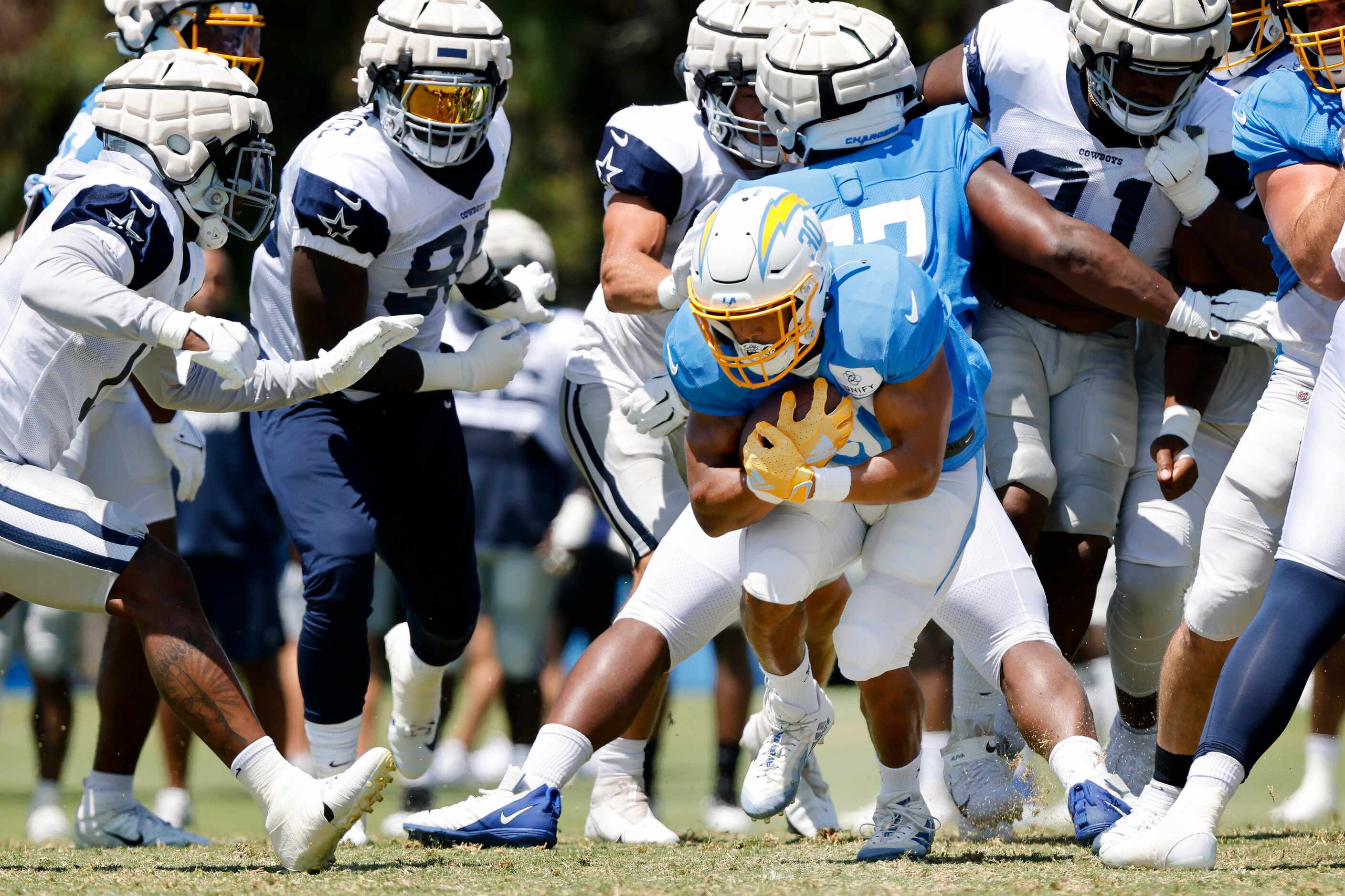 Los Angeles Chargers running back Austin Ekeler (30) finds a hole to run through in the...