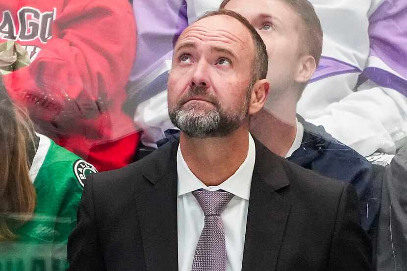 Dallas Stars head coach Pete DeBoer looks up at the scoreboard during the third period of an...