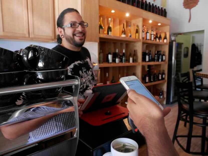 
Adrian Reynoso at The Alcove in Dallas serves free coffee to Marty Martinez, who counts on...