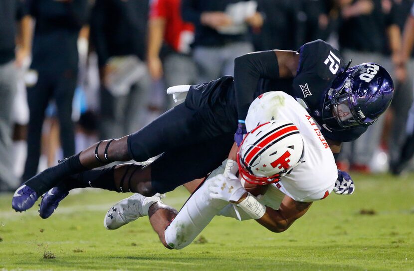 TCU Horned Frogs cornerback Jeff Gladney (12) makes an open field tackle of Texas Tech Red...