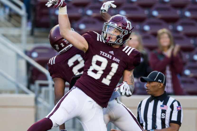 Texas A&M Aggies tight end Jace Sternberger (81) and wide receiver Jhamon Ausbon (2)...