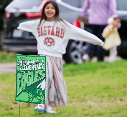 A sign in support of Greenwood Hills Elementary School seen on the front yard of the...