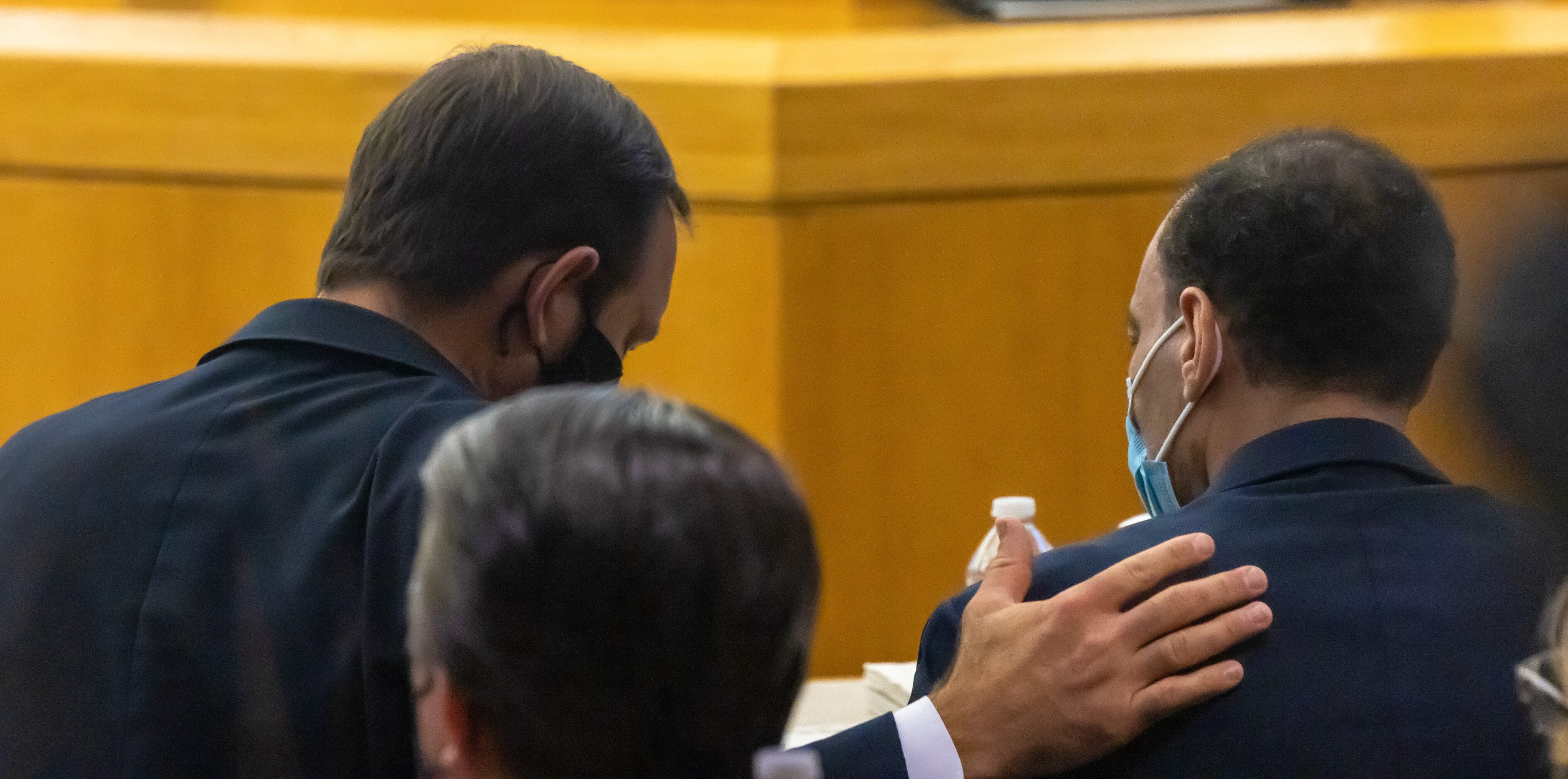 Defense lawyer Joseph Patton (left) lays a hand on the back of Yaser Said during his first...