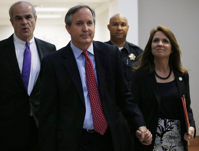  Texas Attorney General Ken Paxton and his wife Angela Paxton enter the Merrill Hartman...