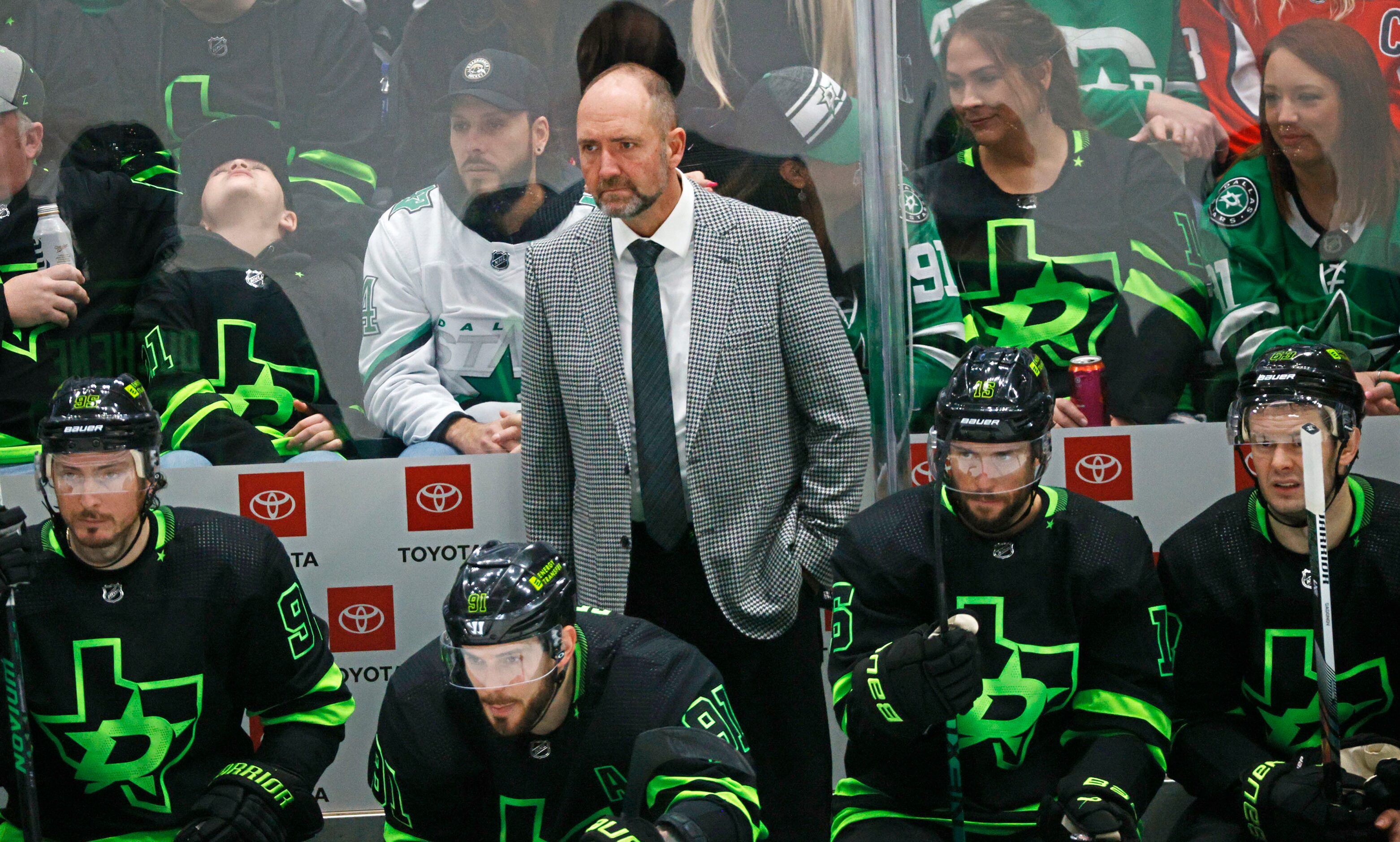 Dallas Stars head coach Peter DeBoer watches his players during the second period of an NHL...