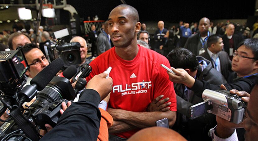  February 13, 2010--West All-Star Kobe Bryant, who is injured and will not play, talks with...