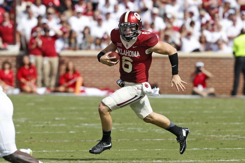 Oklahoma quarterback Baker Mayfield (6) carries during an NCAA college football game against...