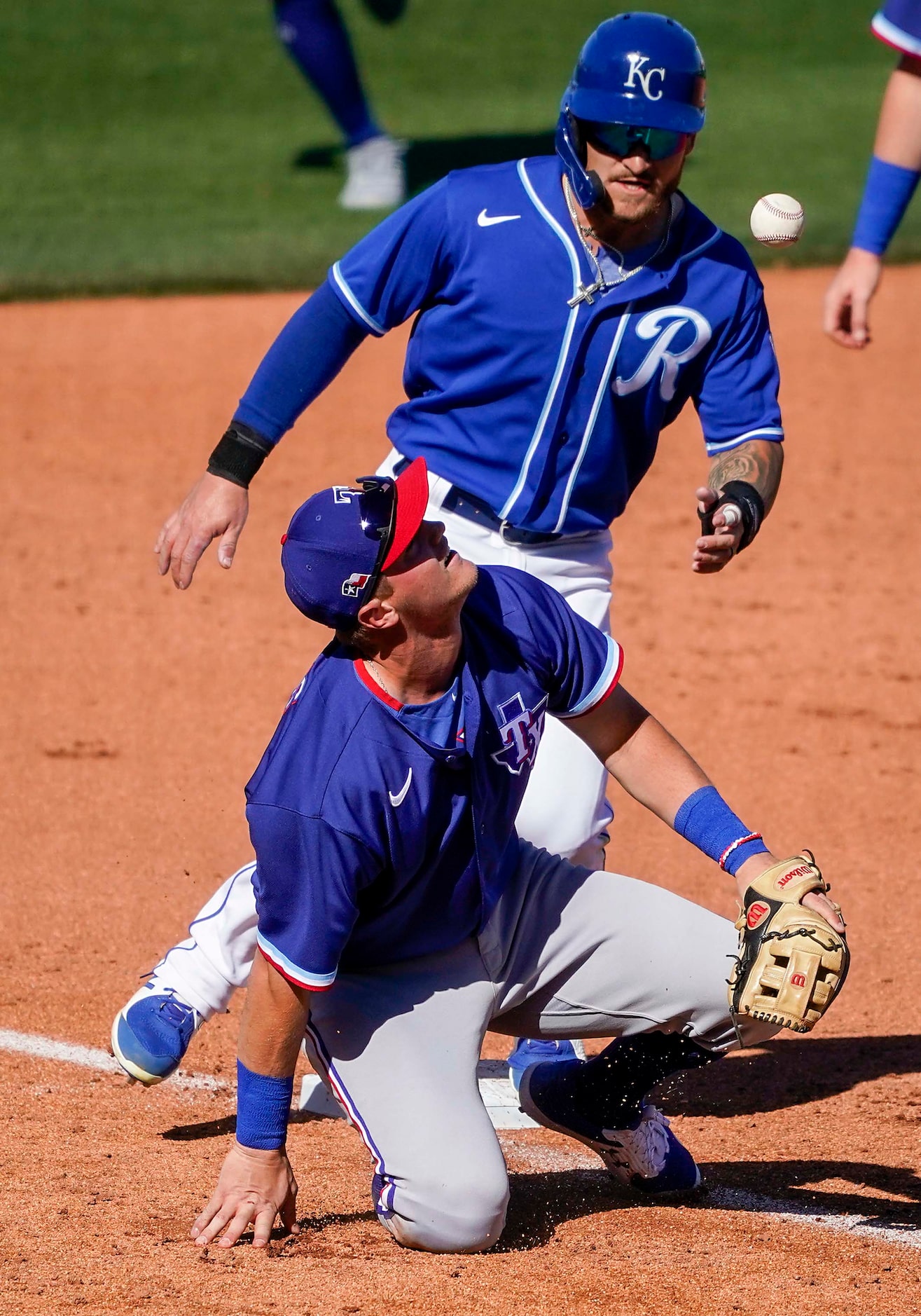 Texas Rangers third baseman Josh Jung can’t make the play on a foul ball off the bat of...