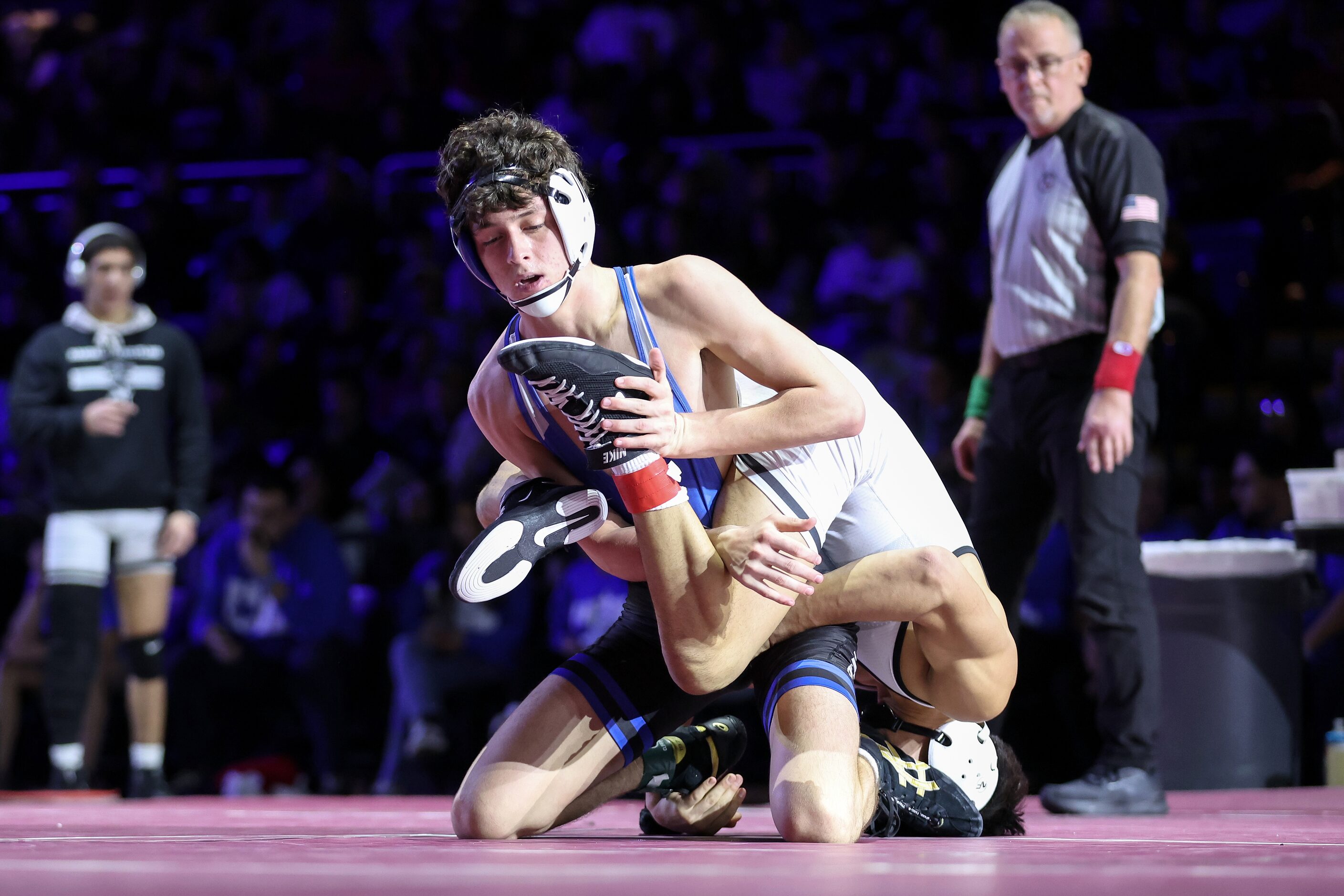 Eli Biermann of Midlothian (blue) competes against Nathaniel Ruiz of Canyon Randall  Boys 5A...