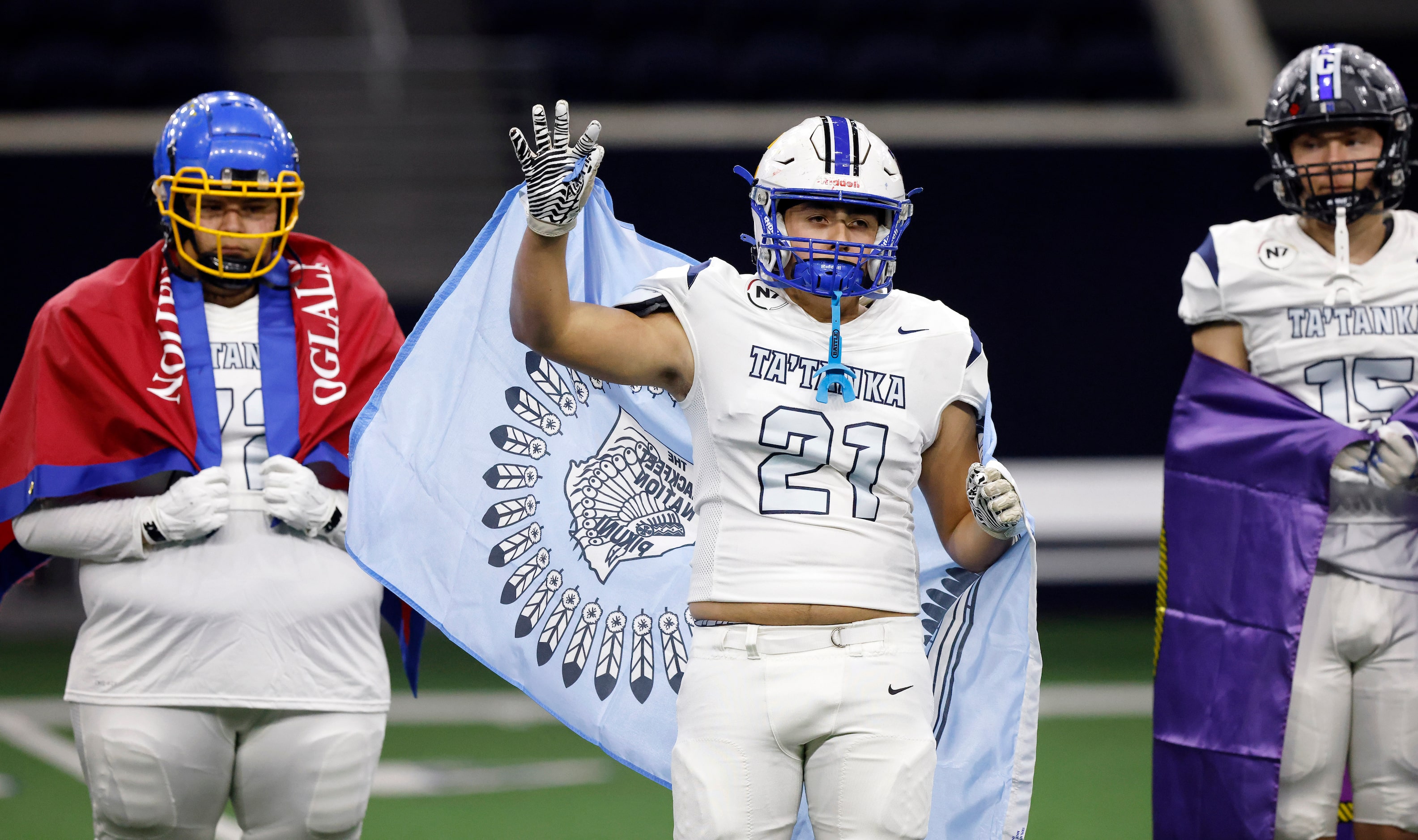 Ta’ Tanka football player Christopher Bell (21) of Havre High (MT) acknowledges the fans as...