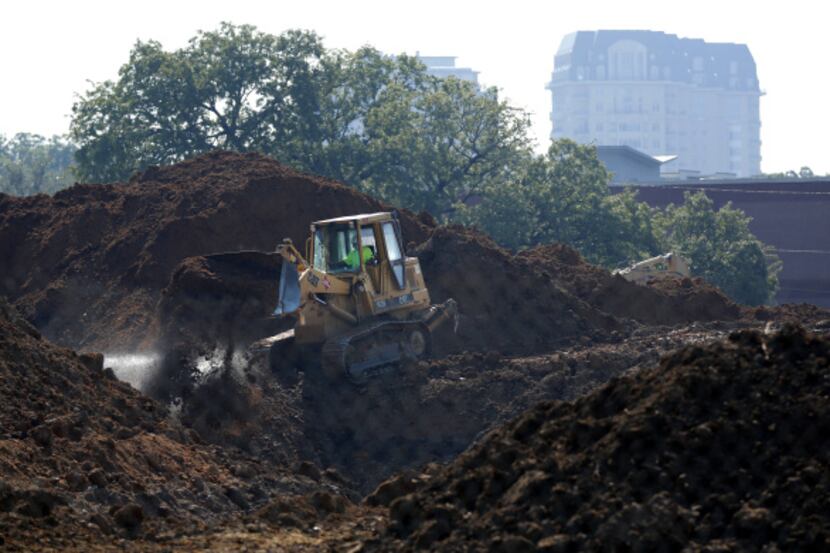 A bulldozer stayed busy clearing land this week as construction proceeds on Ilume Park, a...