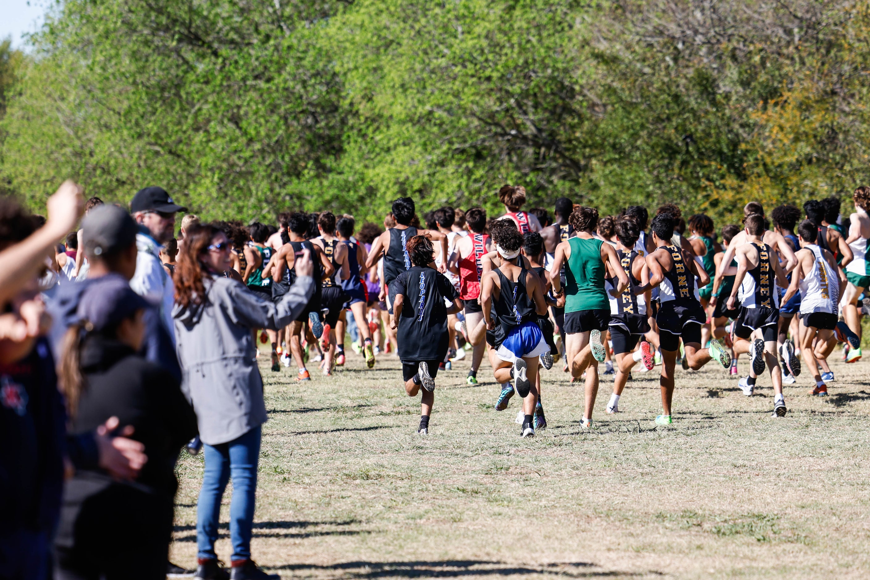 Class 5A boys UIL Region Cross Country Championships race starts at Lynn Creek Park in Grand...