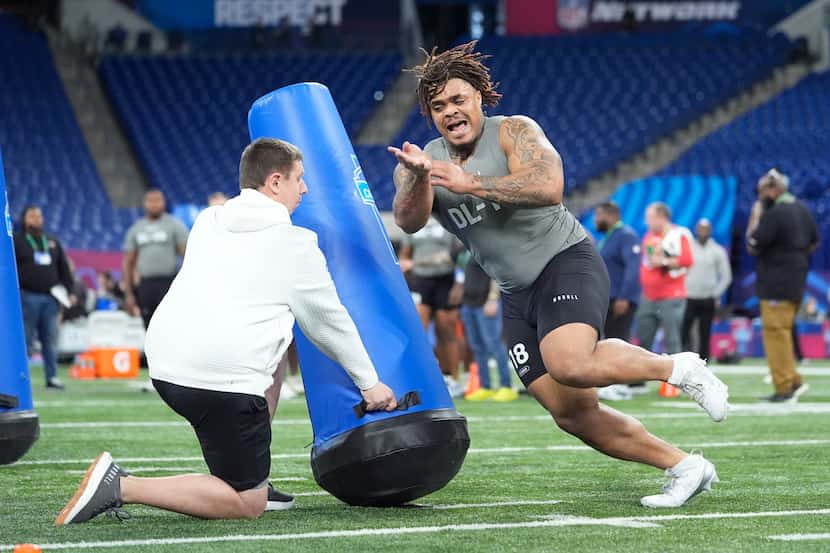 Texas defensive lineman Byron Murphy runs a drill at the NFL football scouting combine,...