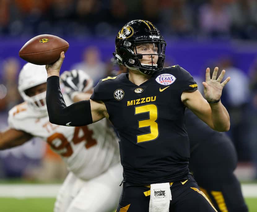 HOUSTON, TX - DECEMBER 27:  Drew Lock #3 of the Missouri Tigers looks for a receiver against...
