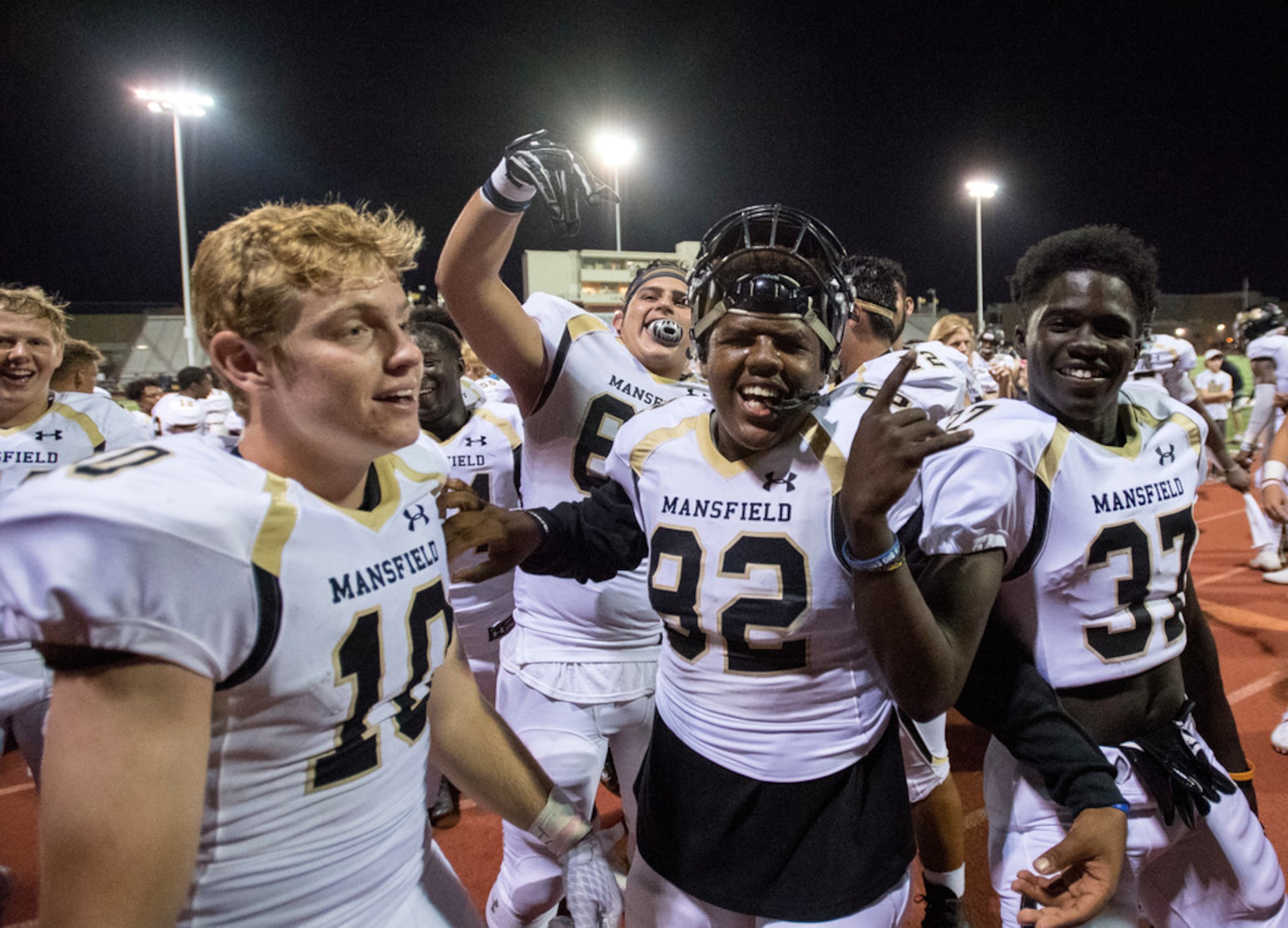 Mansfield players Nick Ellington (10) ZaDavion Williams (82) and Frankie Owusu-Anasah (37)...