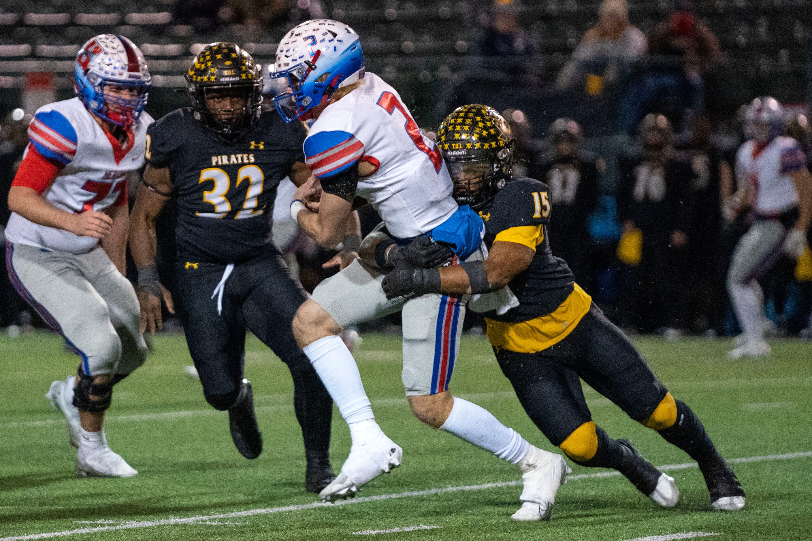 Crandall senior linebacker Jai Turner (15) wraps up Midlothian Heritage senior quarterback...