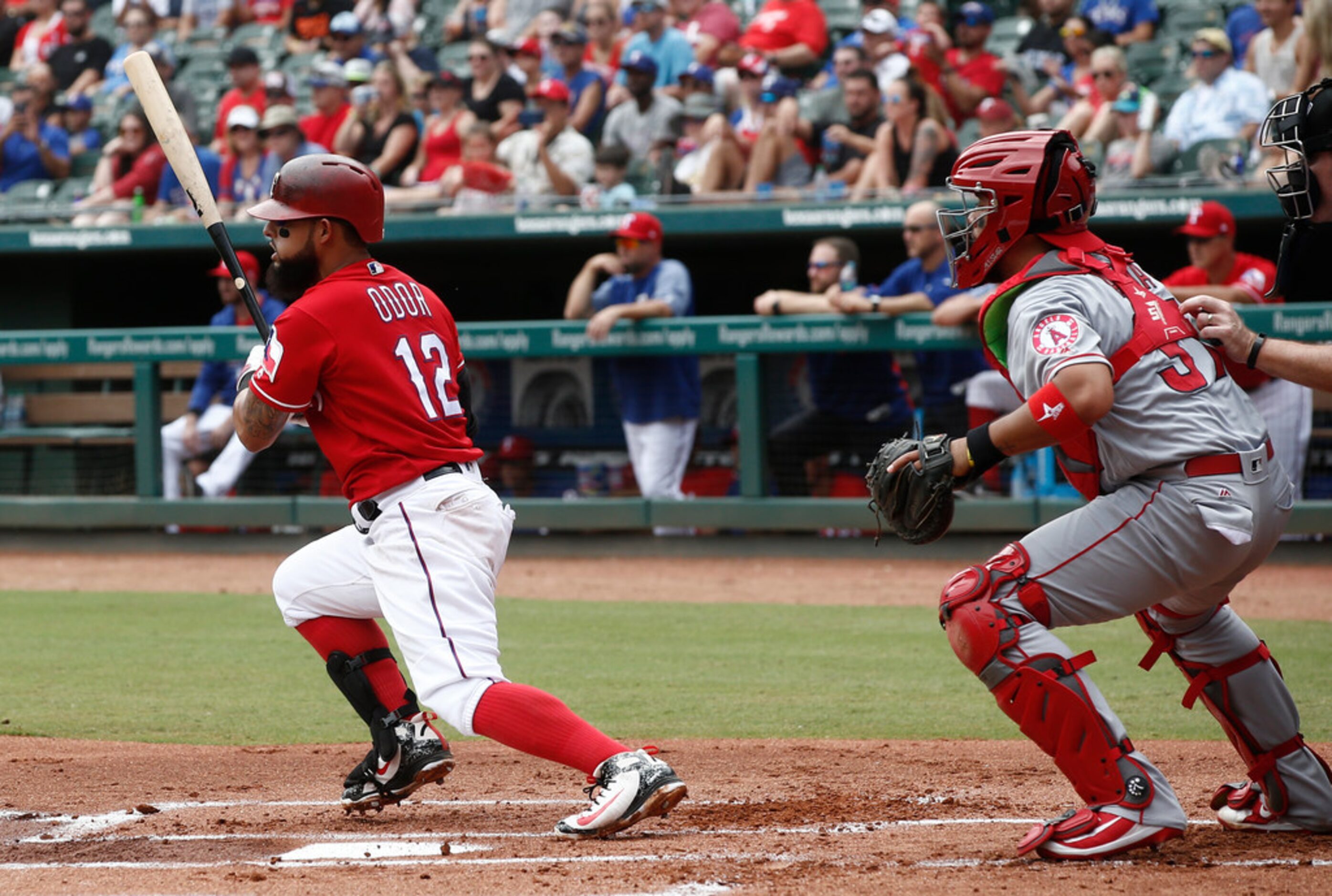 Texas Rangers' Rougned Odor (12) hits a single to drive in Shin-Soo Choo against Los Angeles...