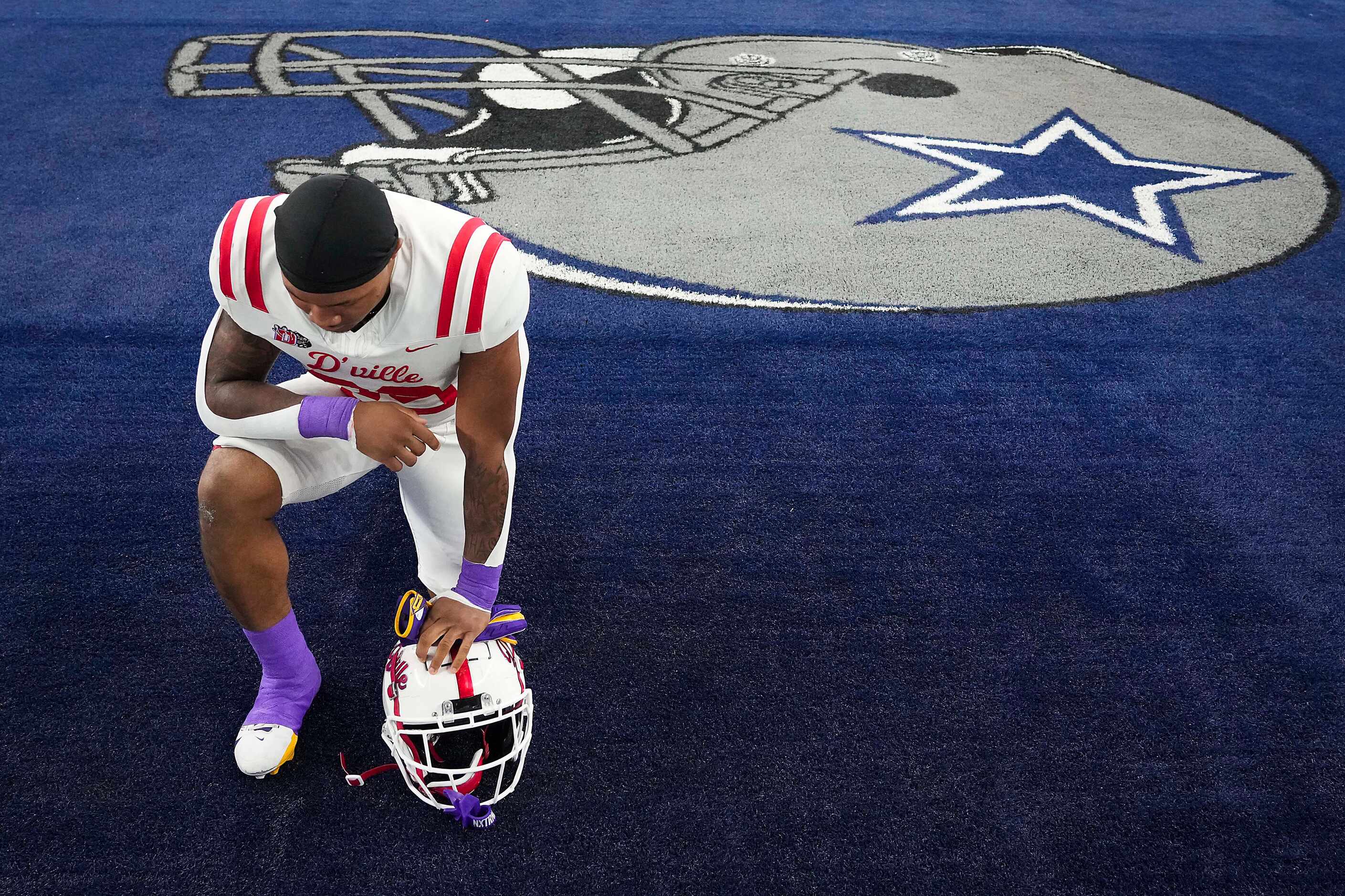Duncanville running back Caden Durham kneels in the end zone before the Class 6A Division I...