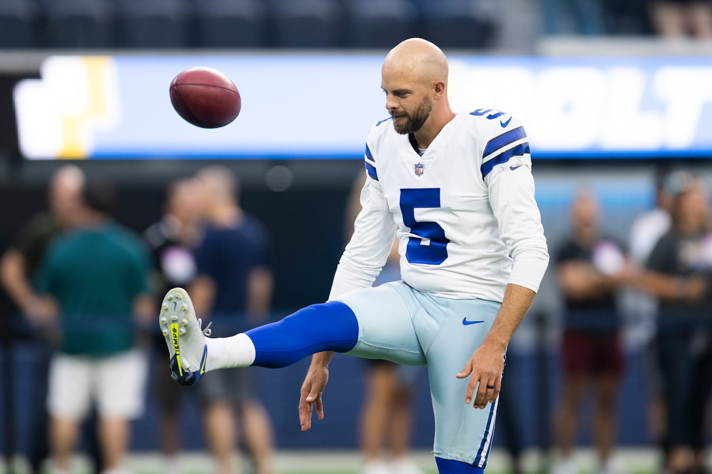 Dallas Cowboys punter Bryan Anger kicks a punt in the second half of an NFL  football game against the Washington Commanders, Sunday, Jan. 8, 2023, in  Landover, Md. (AP Photo/Patrick Semansky Stock