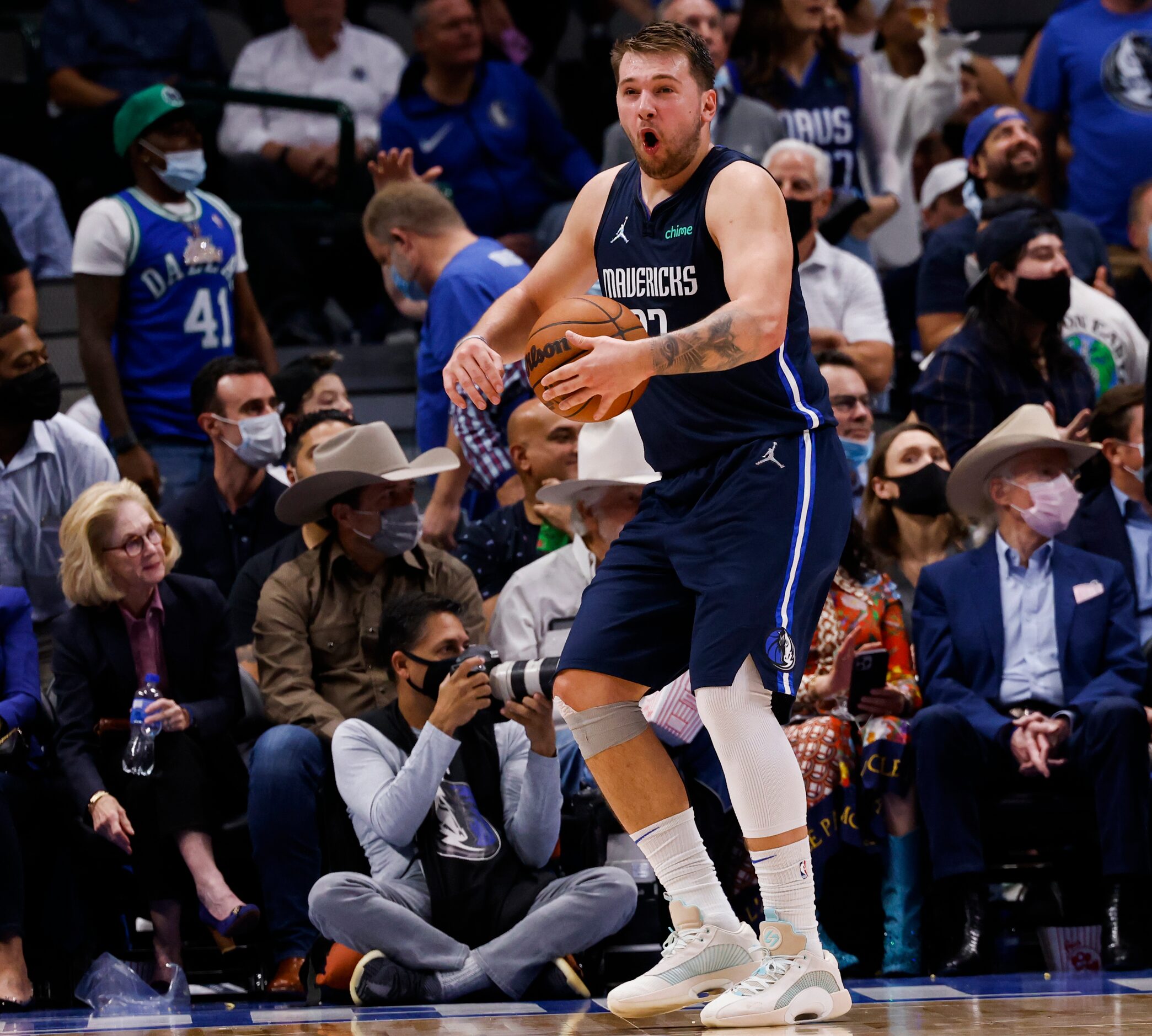 Dallas Mavericks guard Luka Dončić (77) reenacts a fall during the fourth quarter of the...