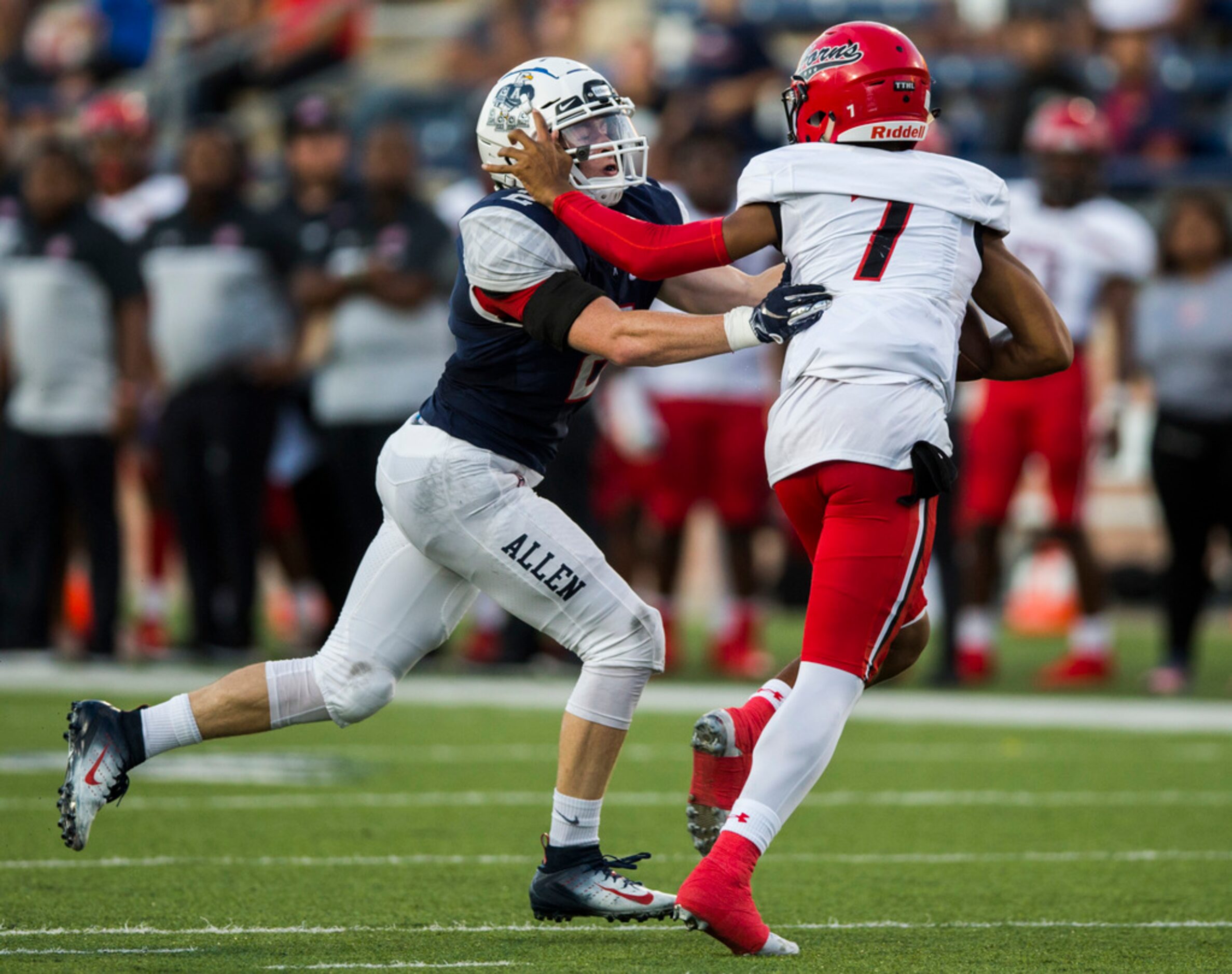 Cedar Hill quarterback Kaidon Salter (7) is sacked by Allen linebacker Jaden Healy (2)...