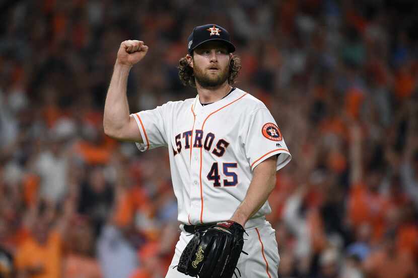 Houston Astros starting pitcher Gerrit Cole (45) reacts after an out against the Tampa Bay...