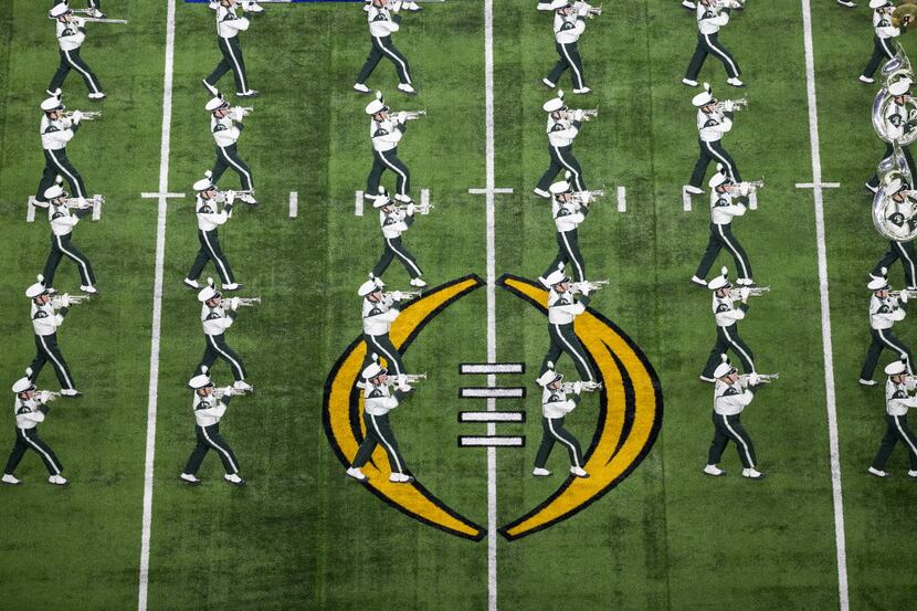 The Michigan State performs before the Goodyear Cotton Bowl game against Alabama at AT&T...