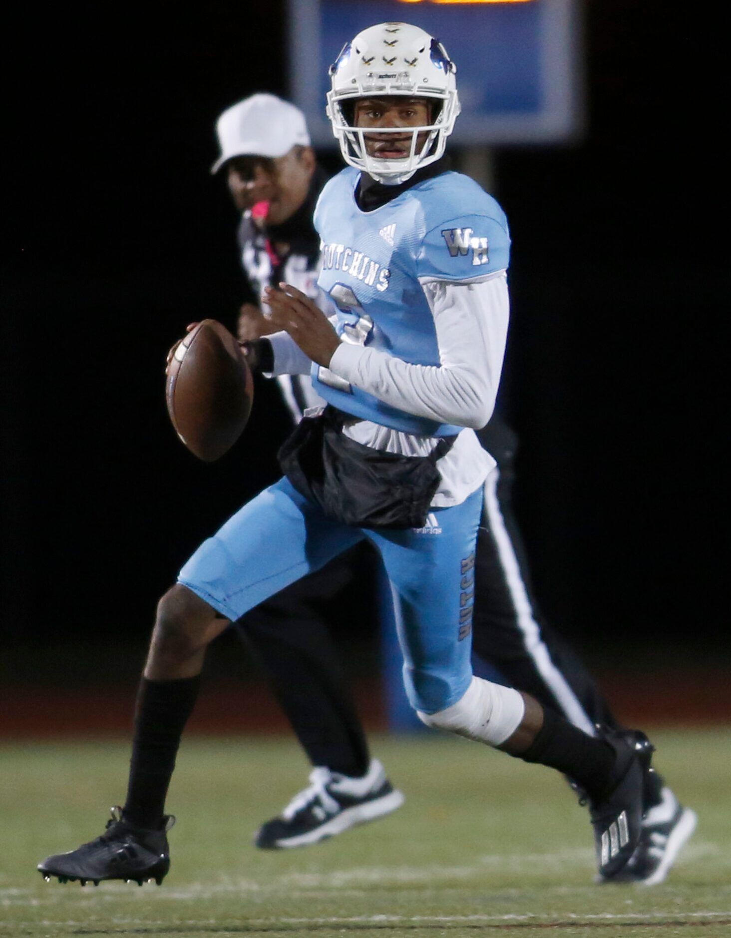 Wilmer Hutchins quarterback Andre Henderson (2) surveys the field as he scrambles during...